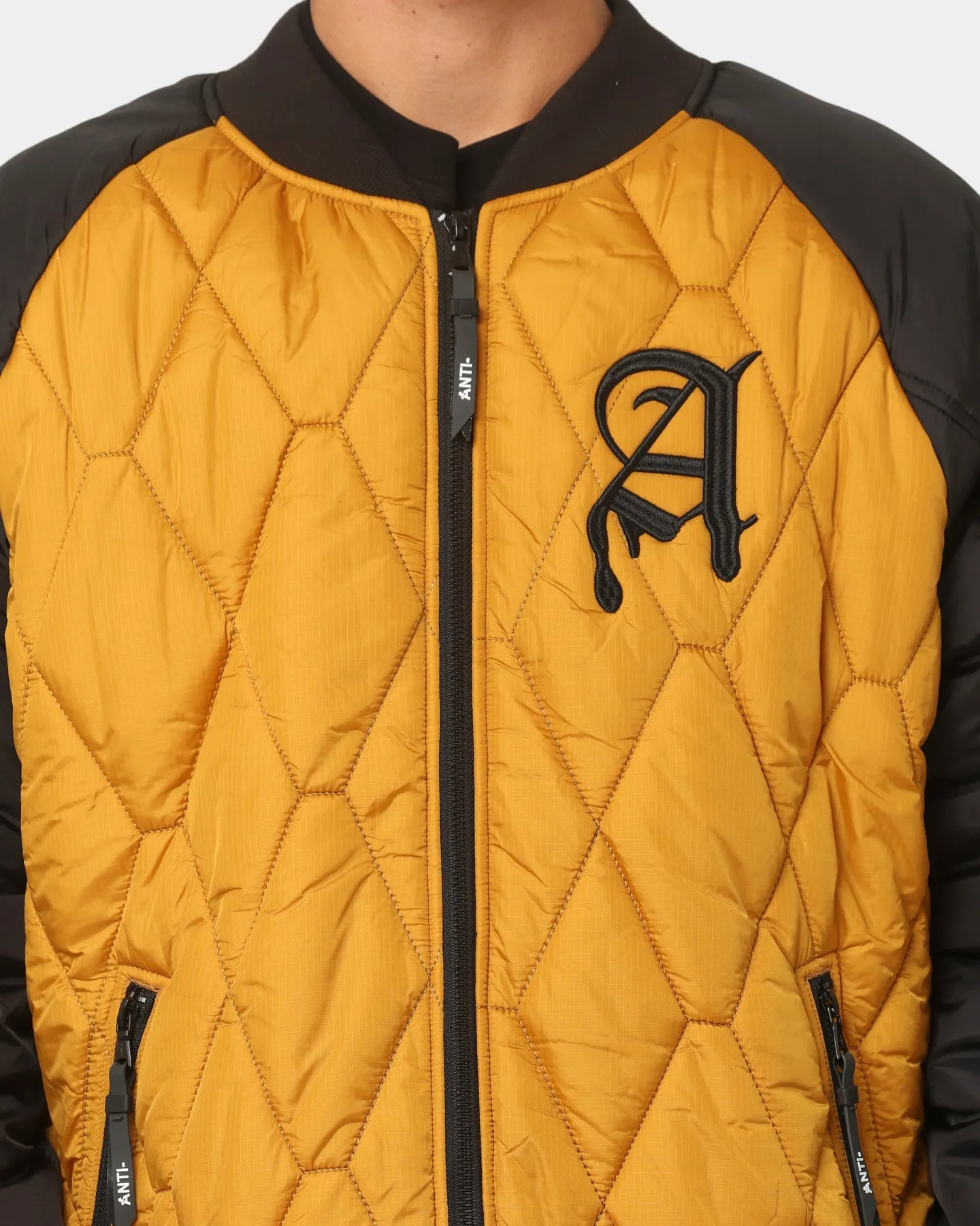 The Anti Order Corvus Quilted Bomber Jacket Mustard/Black/White